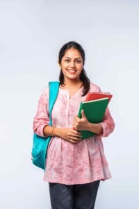 Indian asian young college girl with backpack, laptop, books pointing or ok sign